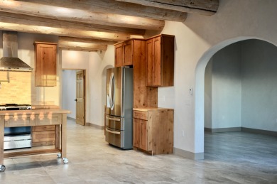 This is a remarkable custom home built in 2025 by renowned local on Taos Country Club in New Mexico - for sale on GolfHomes.com, golf home, golf lot