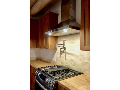 This is a remarkable custom home built in 2025 by renowned local on Taos Country Club in New Mexico - for sale on GolfHomes.com, golf home, golf lot