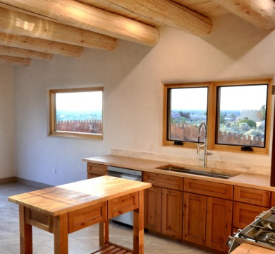 This is a remarkable custom home built in 2025 by renowned local on Taos Country Club in New Mexico - for sale on GolfHomes.com, golf home, golf lot