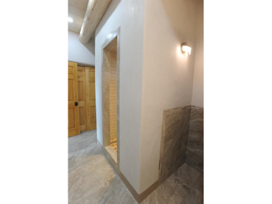 This is a remarkable custom home built in 2025 by renowned local on Taos Country Club in New Mexico - for sale on GolfHomes.com, golf home, golf lot