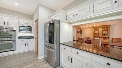 This stunning 3 bedroom, 3.5 bath home, designed by the renowned on The Oaks Club in Florida - for sale on GolfHomes.com, golf home, golf lot