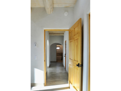 This is a remarkable custom home built in 2025 by renowned local on Taos Country Club in New Mexico - for sale on GolfHomes.com, golf home, golf lot