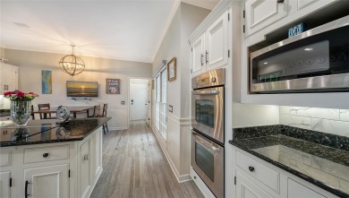 This stunning 3 bedroom, 3.5 bath home, designed by the renowned on The Oaks Club in Florida - for sale on GolfHomes.com, golf home, golf lot