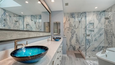 This stunning 3 bedroom, 3.5 bath home, designed by the renowned on The Oaks Club in Florida - for sale on GolfHomes.com, golf home, golf lot