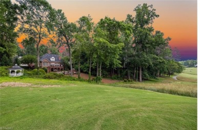Luxury meets lifestyle in this exceptional estate located in on Sedgefield Golf Course in North Carolina - for sale on GolfHomes.com, golf home, golf lot