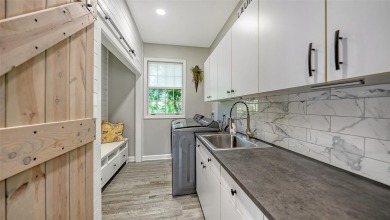 This stunning 3 bedroom, 3.5 bath home, designed by the renowned on The Oaks Club in Florida - for sale on GolfHomes.com, golf home, golf lot