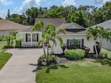 A charming three-bedroom, two-bath, desirable two-car side entry on The River Club in Florida - for sale on GolfHomes.com, golf home, golf lot