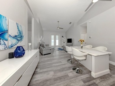 A charming three-bedroom, two-bath, desirable two-car side entry on The River Club in Florida - for sale on GolfHomes.com, golf home, golf lot