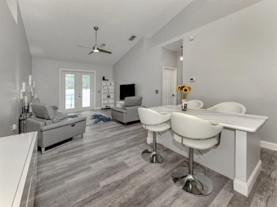 A charming three-bedroom, two-bath, desirable two-car side entry on The River Club in Florida - for sale on GolfHomes.com, golf home, golf lot