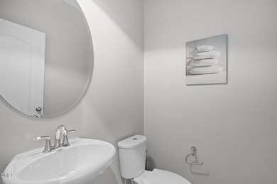 Greeted by a stacked-stone, covered front porch and classic on The Club At Twelve Oaks in North Carolina - for sale on GolfHomes.com, golf home, golf lot