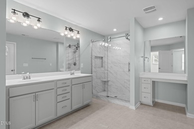 Greeted by a stacked-stone, covered front porch and classic on The Club At Twelve Oaks in North Carolina - for sale on GolfHomes.com, golf home, golf lot