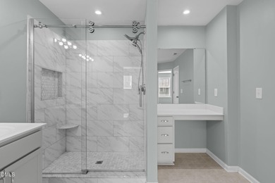 Greeted by a stacked-stone, covered front porch and classic on The Club At Twelve Oaks in North Carolina - for sale on GolfHomes.com, golf home, golf lot