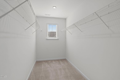 Greeted by a stacked-stone, covered front porch and classic on The Club At Twelve Oaks in North Carolina - for sale on GolfHomes.com, golf home, golf lot