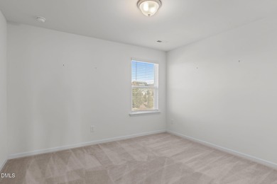 Greeted by a stacked-stone, covered front porch and classic on The Club At Twelve Oaks in North Carolina - for sale on GolfHomes.com, golf home, golf lot