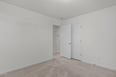 Greeted by a stacked-stone, covered front porch and classic on The Club At Twelve Oaks in North Carolina - for sale on GolfHomes.com, golf home, golf lot