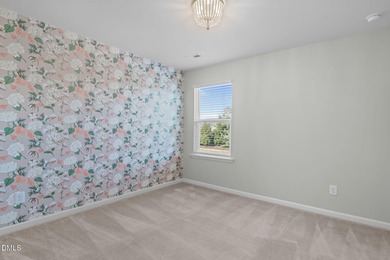 Greeted by a stacked-stone, covered front porch and classic on The Club At Twelve Oaks in North Carolina - for sale on GolfHomes.com, golf home, golf lot