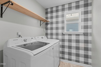 Greeted by a stacked-stone, covered front porch and classic on The Club At Twelve Oaks in North Carolina - for sale on GolfHomes.com, golf home, golf lot