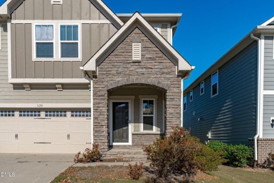 Greeted by a stacked-stone, covered front porch and classic on The Club At Twelve Oaks in North Carolina - for sale on GolfHomes.com, golf home, golf lot