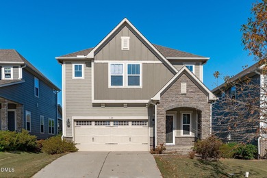 Greeted by a stacked-stone, covered front porch and classic on The Club At Twelve Oaks in North Carolina - for sale on GolfHomes.com, golf home, golf lot
