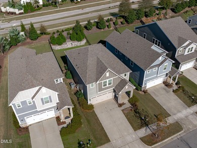 Greeted by a stacked-stone, covered front porch and classic on The Club At Twelve Oaks in North Carolina - for sale on GolfHomes.com, golf home, golf lot