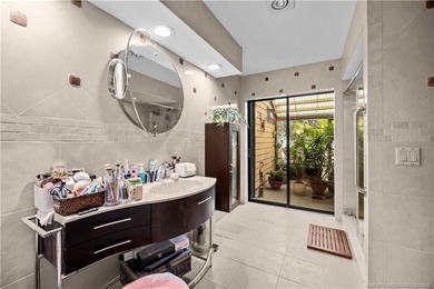 Discover a rare, tropical, secret garden within the gated on Martin Downs Country Club in Florida - for sale on GolfHomes.com, golf home, golf lot