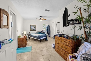 Discover a rare, tropical, secret garden within the gated on Martin Downs Country Club in Florida - for sale on GolfHomes.com, golf home, golf lot