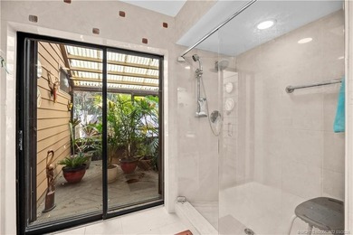 Discover a rare, tropical, secret garden within the gated on Martin Downs Country Club in Florida - for sale on GolfHomes.com, golf home, golf lot