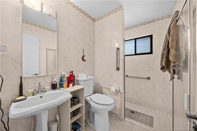 Discover a rare, tropical, secret garden within the gated on Martin Downs Country Club in Florida - for sale on GolfHomes.com, golf home, golf lot