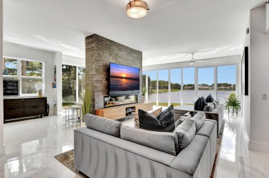 Spectacular contemporary condo features cinematic water views on Broken Sound Golf and Club  in Florida - for sale on GolfHomes.com, golf home, golf lot