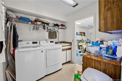 Discover a rare, tropical, secret garden within the gated on Martin Downs Country Club in Florida - for sale on GolfHomes.com, golf home, golf lot