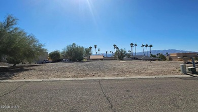 This exceptional vacant lot sits on a quiet, low-traffic road in on London Bridge Golf Course in Arizona - for sale on GolfHomes.com, golf home, golf lot