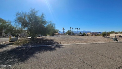 This exceptional vacant lot sits on a quiet, low-traffic road in on London Bridge Golf Course in Arizona - for sale on GolfHomes.com, golf home, golf lot