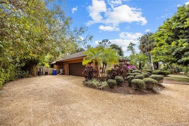 Discover a rare, tropical, secret garden within the gated on Martin Downs Country Club in Florida - for sale on GolfHomes.com, golf home, golf lot