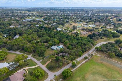 Discover a rare, tropical, secret garden within the gated on Martin Downs Country Club in Florida - for sale on GolfHomes.com, golf home, golf lot