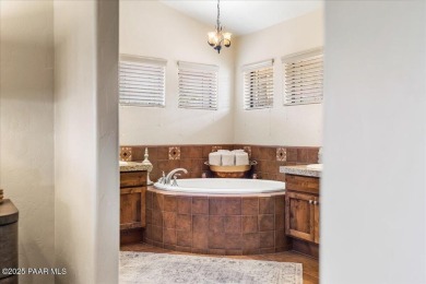 Custom home in The Estates at Prescott Lakes offering panoramic on Prescott Lakes Golf and Country Club in Arizona - for sale on GolfHomes.com, golf home, golf lot