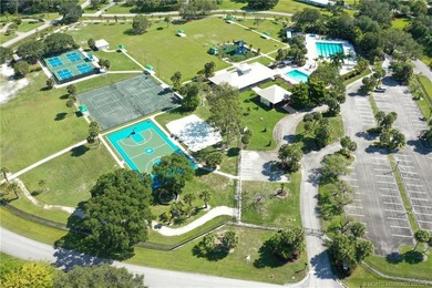 Discover a rare, tropical, secret garden within the gated on Martin Downs Country Club in Florida - for sale on GolfHomes.com, golf home, golf lot