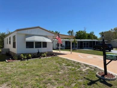 Charming Turnkey Home on a Perimeter Lot!    This home is in on Lake Henry Golf Club in Florida - for sale on GolfHomes.com, golf home, golf lot