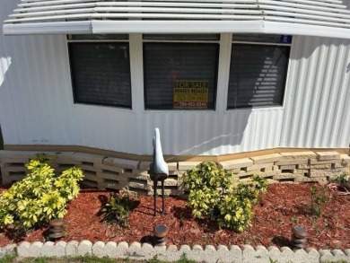 Charming Turnkey Home on a Perimeter Lot!    This home is in on Lake Henry Golf Club in Florida - for sale on GolfHomes.com, golf home, golf lot
