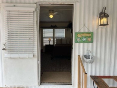 Charming Turnkey Home on a Perimeter Lot!    This home is in on Lake Henry Golf Club in Florida - for sale on GolfHomes.com, golf home, golf lot