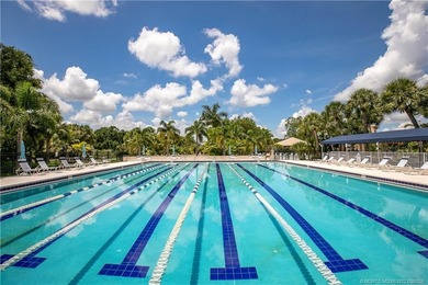 Discover a rare, tropical, secret garden within the gated on Martin Downs Country Club in Florida - for sale on GolfHomes.com, golf home, golf lot