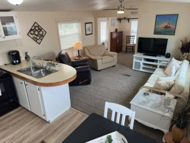 Charming Turnkey Home on a Perimeter Lot!    This home is in on Lake Henry Golf Club in Florida - for sale on GolfHomes.com, golf home, golf lot