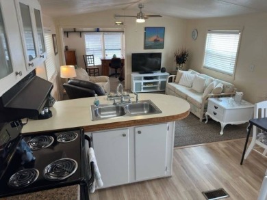 Charming Turnkey Home on a Perimeter Lot!    This home is in on Lake Henry Golf Club in Florida - for sale on GolfHomes.com, golf home, golf lot