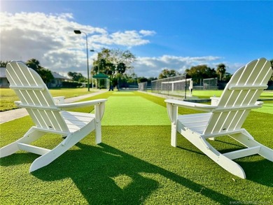 Discover a rare, tropical, secret garden within the gated on Martin Downs Country Club in Florida - for sale on GolfHomes.com, golf home, golf lot