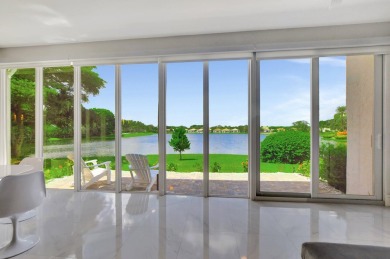 Spectacular contemporary condo features cinematic water views on Broken Sound Golf and Club  in Florida - for sale on GolfHomes.com, golf home, golf lot