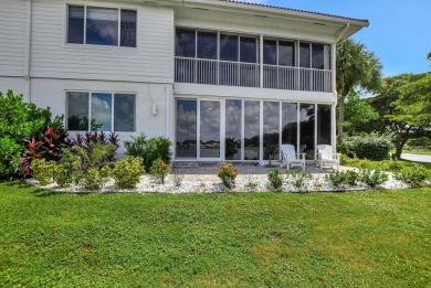 Spectacular contemporary condo features cinematic water views on Broken Sound Golf and Club  in Florida - for sale on GolfHomes.com, golf home, golf lot