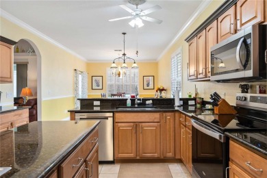 Welcome to this stunning 3-bedroom, 2-bath Eaton model home with on Kings Gate Golf Club in Florida - for sale on GolfHomes.com, golf home, golf lot