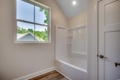 Welcome to 1673 Carriage Ln in Little River, SC -- a modern on Glen Dornoch Waterway Golf Links in South Carolina - for sale on GolfHomes.com, golf home, golf lot
