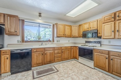 This charming 3-bedroom, 2-bath home offers red rock views and on Sedona Golf Resort in Arizona - for sale on GolfHomes.com, golf home, golf lot