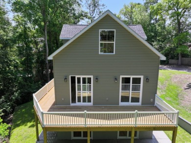 Welcome to 1673 Carriage Ln in Little River, SC -- a modern on Glen Dornoch Waterway Golf Links in South Carolina - for sale on GolfHomes.com, golf home, golf lot