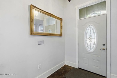 Perfectly positioned along the 10th fairway of Bay Pointe Golf on Bay Pointe Golf and Resort in Mississippi - for sale on GolfHomes.com, golf home, golf lot